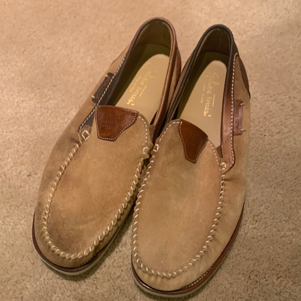 Some discoloration on right shoe from oil leaking in suitcase. Worn only twice